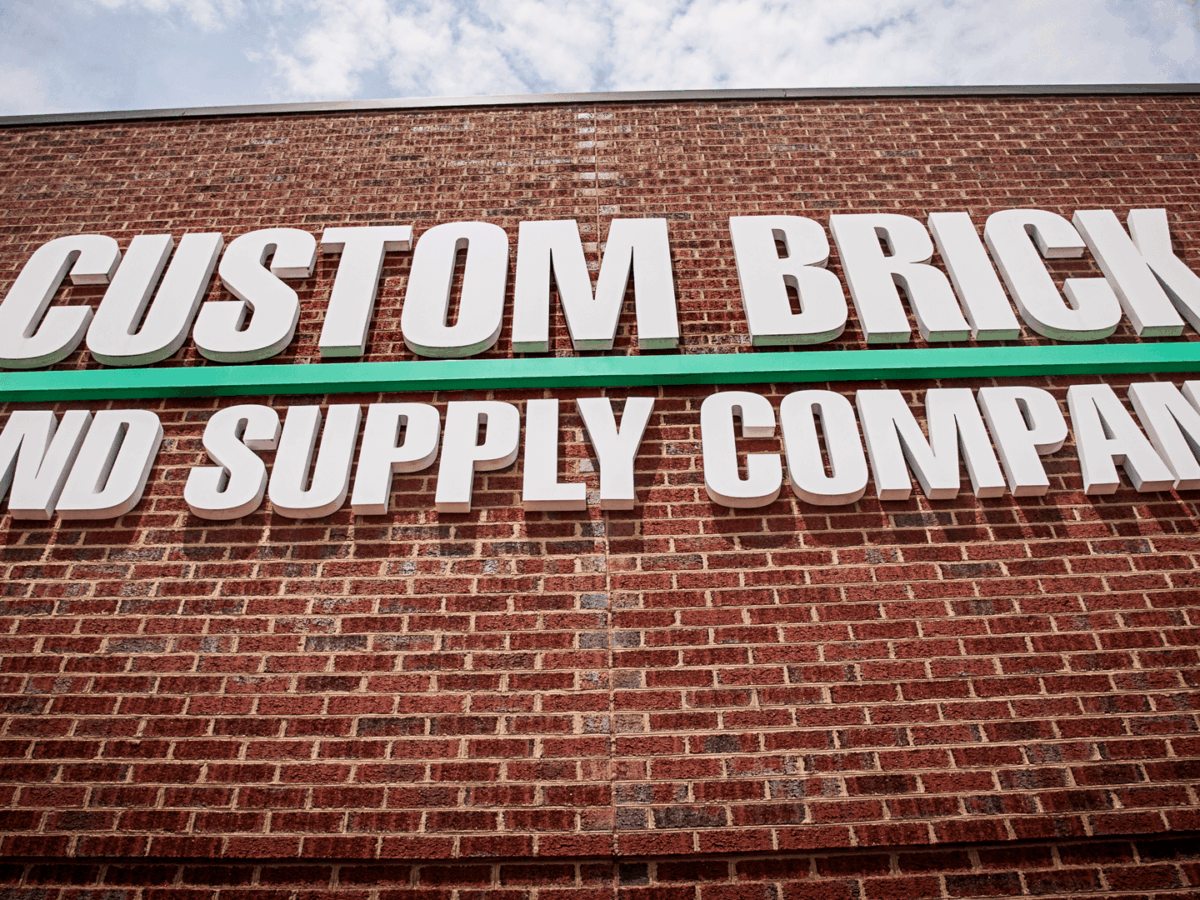 Custom Brick & Supply Company showroom building sign